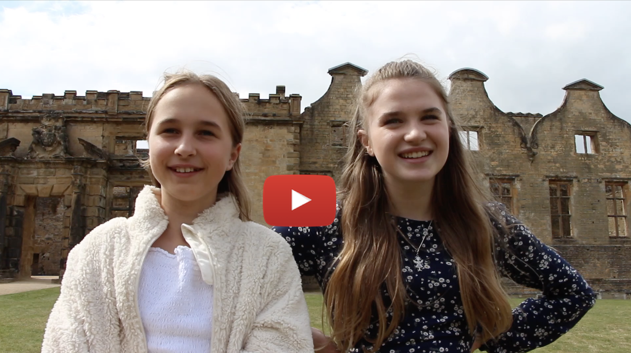 two young people at bolsover castle, there's a red youtube play arrow over the image