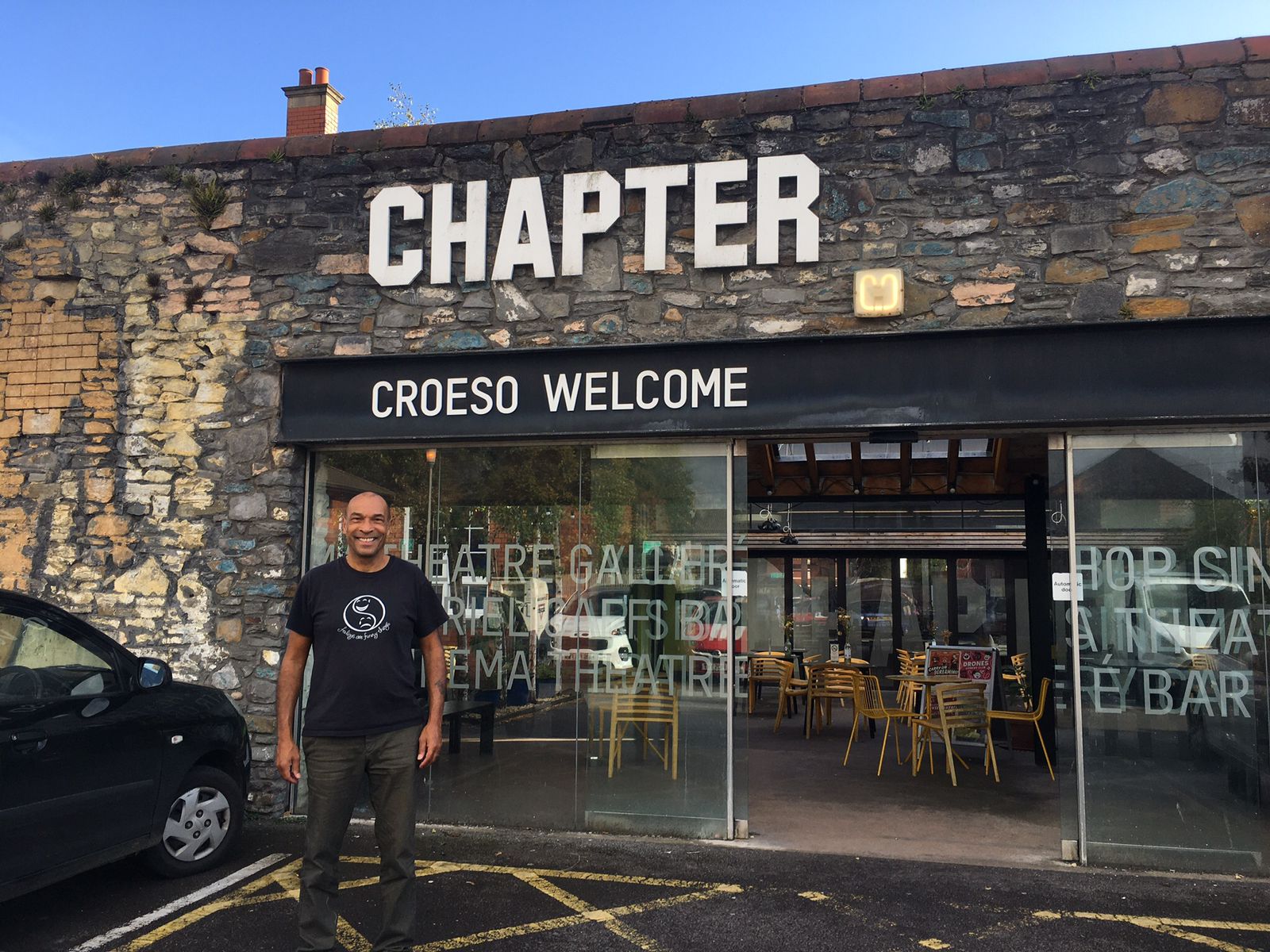 storyteller phil okwedy standing outside chapter arts centre