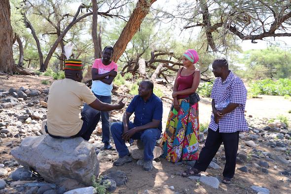 From left: Abdi Achegei Adan, the Director of Elemi Development Organization, John Namai (a storyteller) Calistus Wachana (ICPAC User Engagement Expert), Mara Menzies (a storyteller) and Francis Muinda (Turkana County Meteorological Services Director) during an interview at the Lokiriama Peace Accord Commemoration in Lokiriama village, Turkana County, Kenya