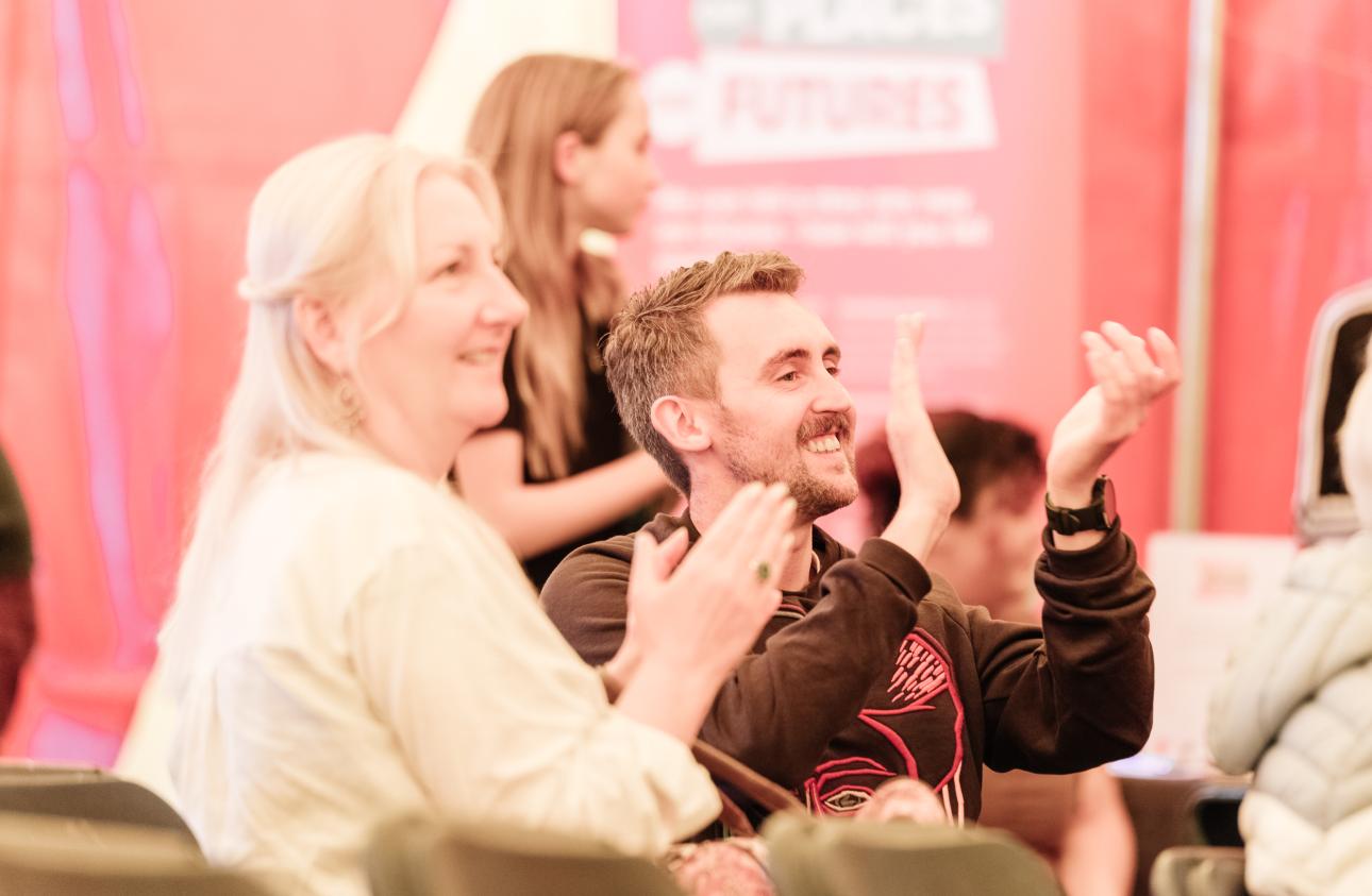 storytellers Lewis Doherty & Maria Whatton clap the peformance in the big top at tapton lock festival