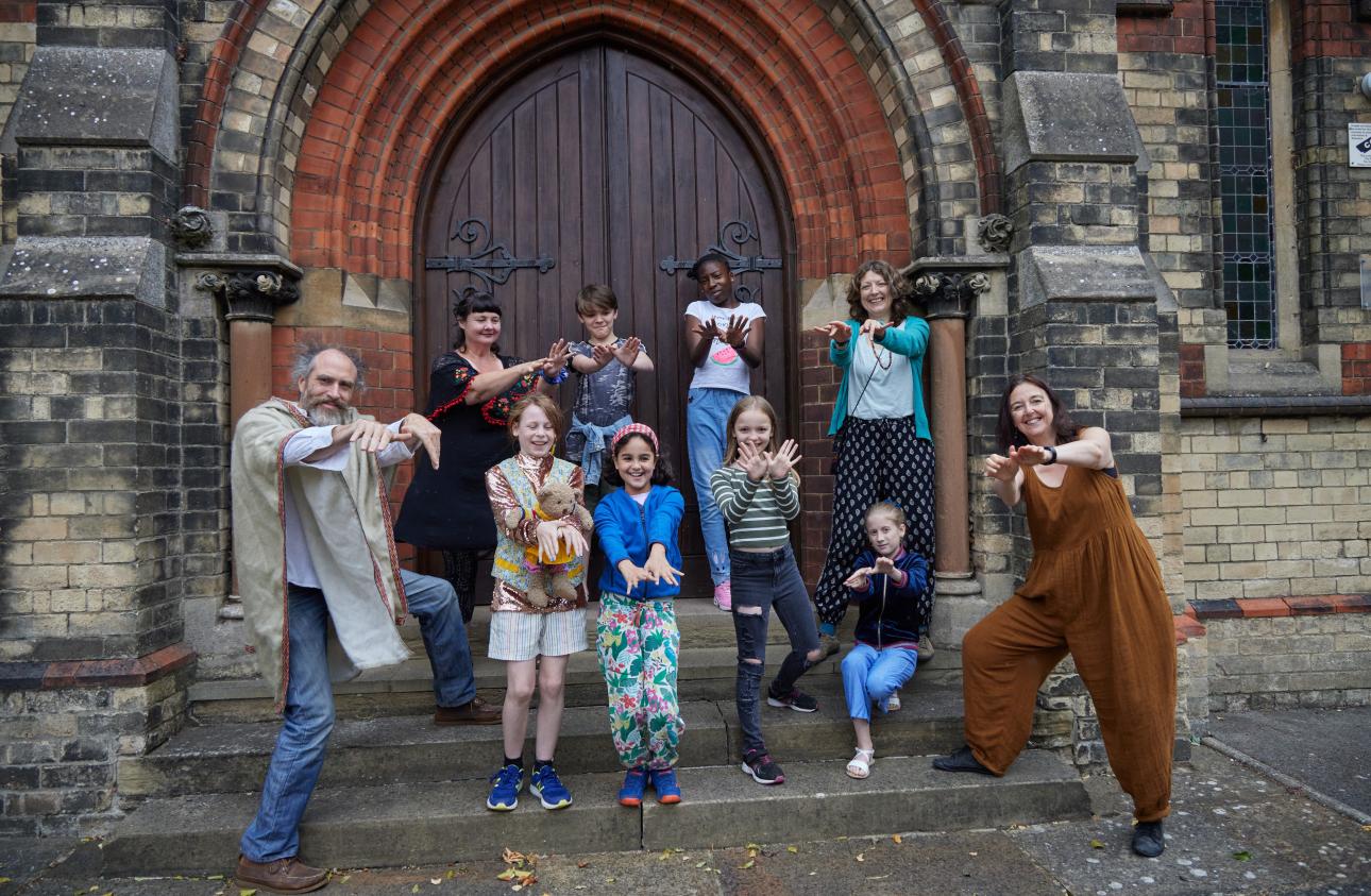 Teachers and young participants from the Make Your Story workshop on the steps of the venue